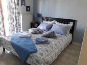 A bed or beds in a room at Τhe Roses House