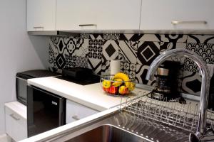 Kuchyň nebo kuchyňský kout v ubytování Liston Apartment + 9 fotografií