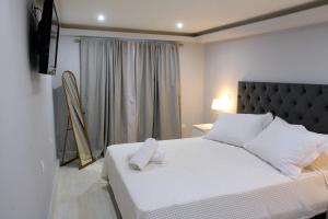 Postel nebo postele na pokoji v ubytování Liston Apartment