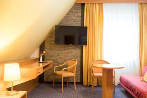 TV a/nebo společenská místnost v ubytování Hotel Restaurant Jägerhof