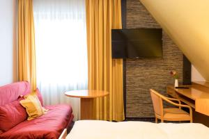 TV a/nebo společenská místnost v ubytování Hotel Restaurant Jägerhof