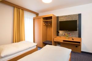 Postel nebo postele na pokoji v ubytování Hotel Restaurant Jägerhof