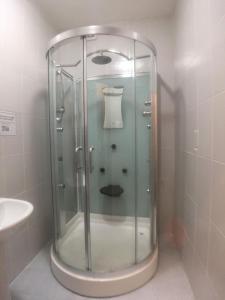a glass shower in a bathroom with a sink at OutRam 26 in Stockton-on-Tees