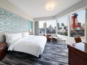 a hotel room with a bed and a large window at The Prince Park Tower Tokyo - Preferred Hotels & Resorts, LVX Collection in Tokyo +37 photos