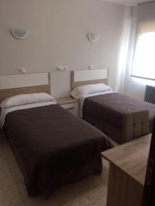 Кровать или кровати в номере Hotel Venta Nueva
