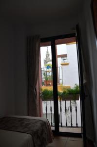A bed or beds in a room at Hotel Doña Lina