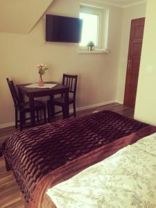 Posteľ alebo postele v izbe v ubytovaní Apartamenty Milka