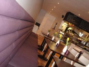 a view of a restaurant with tables and a bar at OutRam 26 in Stockton-on-Tees