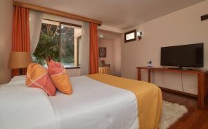 Postel nebo postele na pokoji v ubytování Hotel del Valle Azapa