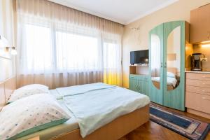 Posteľ alebo postele v izbe v ubytovaní Lara Apartments