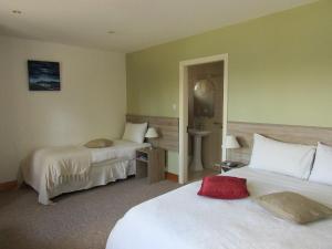 Ένα ή περισσότερα κρεβάτια σε δωμάτιο στο Watersedge Seaviews