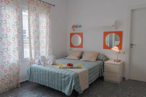Posteľ alebo postele v izbe v ubytovaní Ático con terraza y vistas