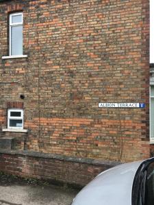 a brick building with a street sign on it at Albion House in Doncaster