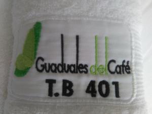 a towel with the words guvolumes oral care tb at Apartahotel Paraíso Cafetero Guaduales del café 401B in Montenegro