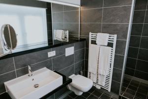 Ένα μπάνιο στο Hotel New Regina