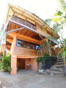 a house with stairs leading up to it at Banana Moon in Ambatoloaka