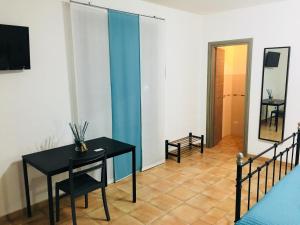 TV a/nebo společenská místnost v ubytování B&B Tramonti d'aMare