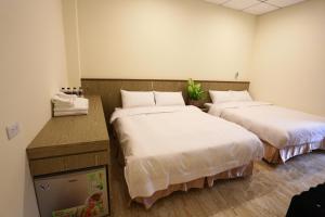 Tempat tidur dalam kamar di ChangJu Hotel