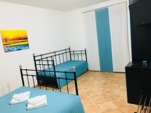 Postel nebo postele na pokoji v ubytování B&B Tramonti d'aMare