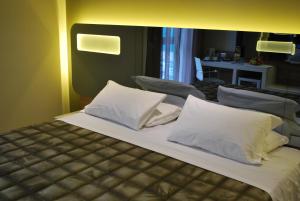 Postel nebo postele na pokoji v ubytování Idea Hotel Plus Savona