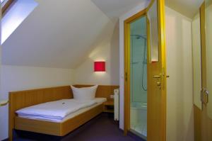 Postel nebo postele na pokoji v ubytování Hotel Park Eckersbach