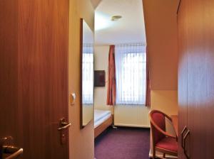 Postel nebo postele na pokoji v ubytování Hotel Park Eckersbach