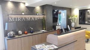 aarmaarma store with a sign on the wall at Hotel Miramar- Cap d'Antibes - La Garoupe plage in Antibes