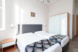 Voodi või voodid majutusasutuse Hotel St. James toas