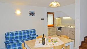 Kuchyň nebo kuchyňský kout v ubytování La Rotonda apartments by Gardadomusmea