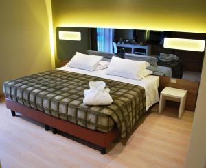 Postel nebo postele na pokoji v ubytování Idea Hotel Plus Savona