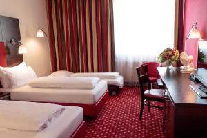 En eller flere senger på et rom på Best Western Plaza Hotel Wels