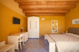 Hotel Casale Milocca客房内的一张或多张床位