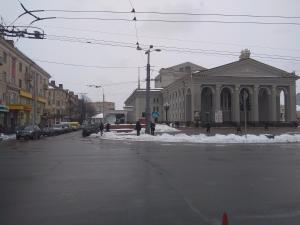 an empty street in a city with a building at Apartment on Sobornaya street in Rivne