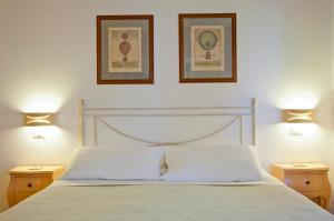 A bed or beds in a room at L'Orso e L'Ape B&B