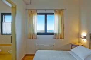A bed or beds in a room at L'Orso e L'Ape B&B
