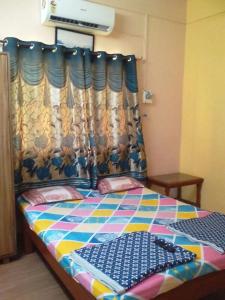 Postel nebo postele na pokoji v ubytování Hotel Anjali Lodge Malvan