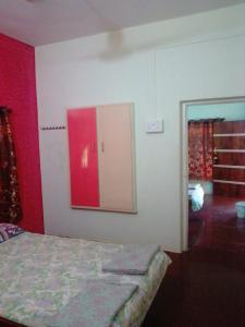 Postel nebo postele na pokoji v ubytování Hotel Anjali Lodge Malvan