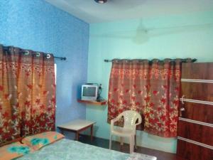TV a/nebo společenská místnost v ubytování Hotel Anjali Lodge Malvan