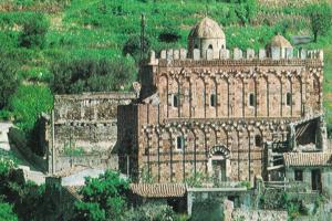 a large brick building on top of a hill at Il Guscio in Santa Teresa di Riva