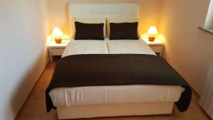 Posteľ alebo postele v izbe v ubytovaní Rooms & Apartments Giulia