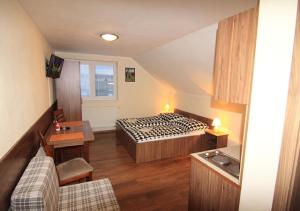 Posteľ alebo postele v izbe v ubytovaní Apartmánový dom Stela