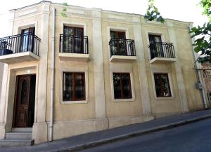 a building with balconies on the side of it at New House in Old Tbilisi in Tbilisi City