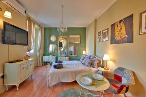 a living room with a bed and a table at Old City Romantic Studio with FREE private parking in Pula