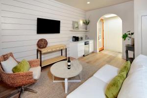a living room with a couch and a table at Rockhouse Suites in Healdsburg