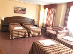 Un pat sau paturi într-o cameră la Relais Des Alpes