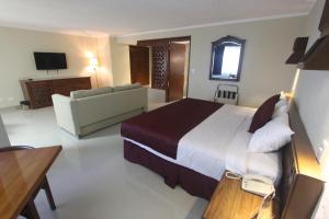 TV a/nebo společenská místnost v ubytování Hotel Plaza Kokai Cancún