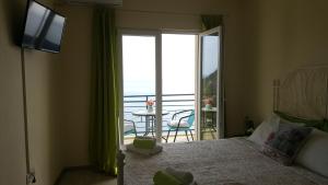 Uma cama ou camas num quarto em Lighthouse Apartments