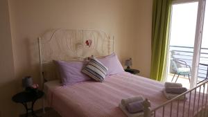 Uma cama ou camas num quarto em Lighthouse Apartments