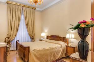 En eller flere senger på et rom på Villa Fenaroli Palace Hotel + 37 bilder
