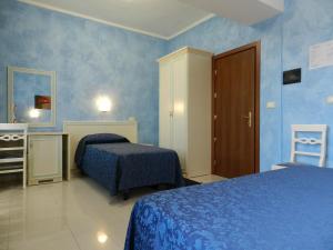 Llit o llits en una habitació de Hotel Air Palace Lingotto